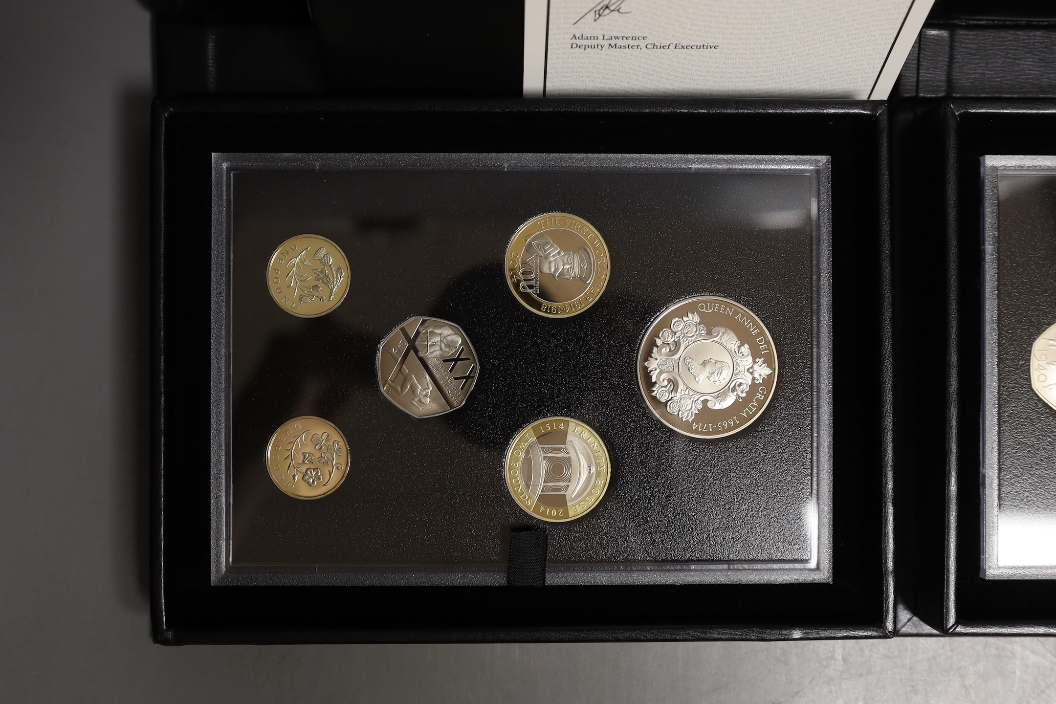 Two UK Royal Mint commemorative edition proof coin sets for 2014 and 2015, cased with certificates